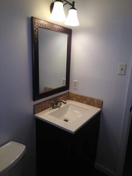 With accent tiling and a new vanity, this bathroom has been transformed! 